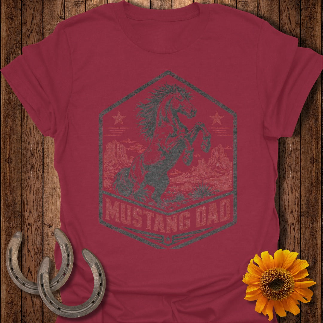 Dark gray distressed mustang graphic with "MUSTANG DAD" text on maroon t-shirt.