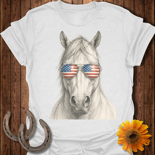 Horse wearing sunglasses with American flag print.