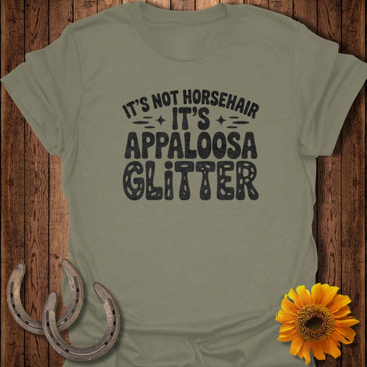 Green t-shirt with "It's Not Horsehair, It's Appaloosa Glitter" text.
