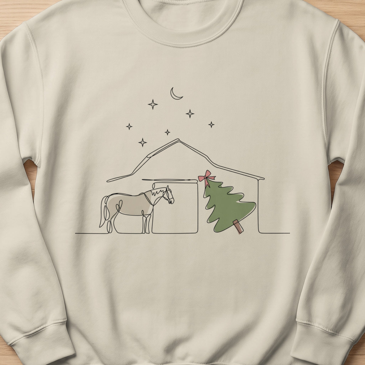 Line drawing of horse by barn with Christmas tree and moon and stars.