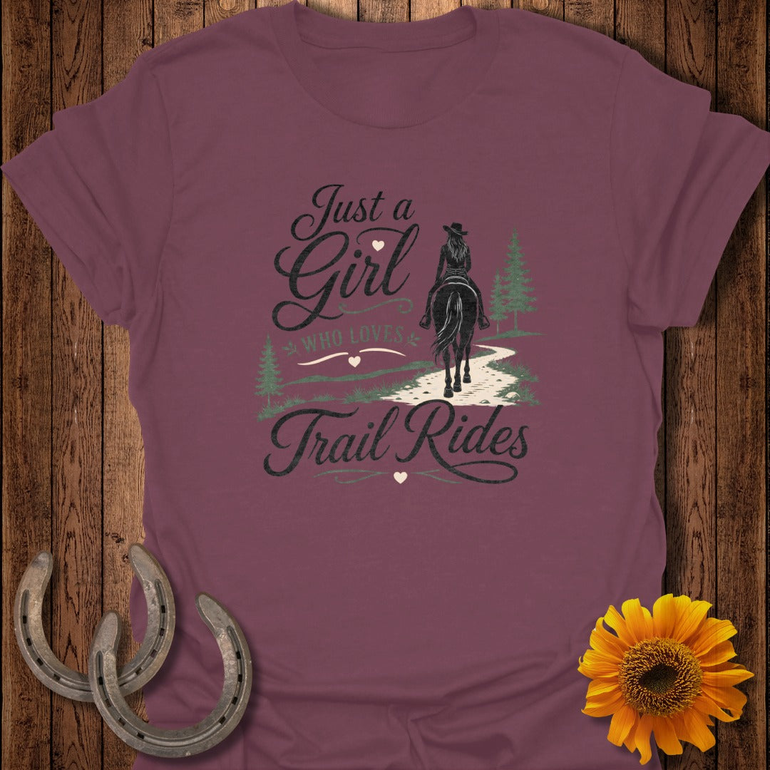 Burgundy t-shirt with "Just a Girl WHO LOVES Trail Rides" text and horse rider graphic.