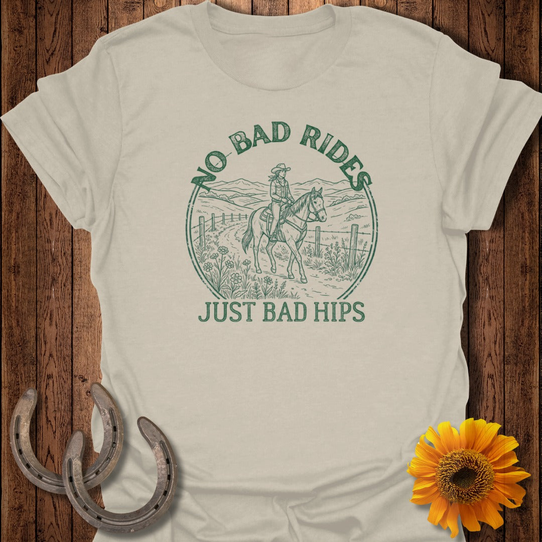 T-shirt with circular graphic of rider on horse and text "NO BAD RIDES JUST BAD HIPS."