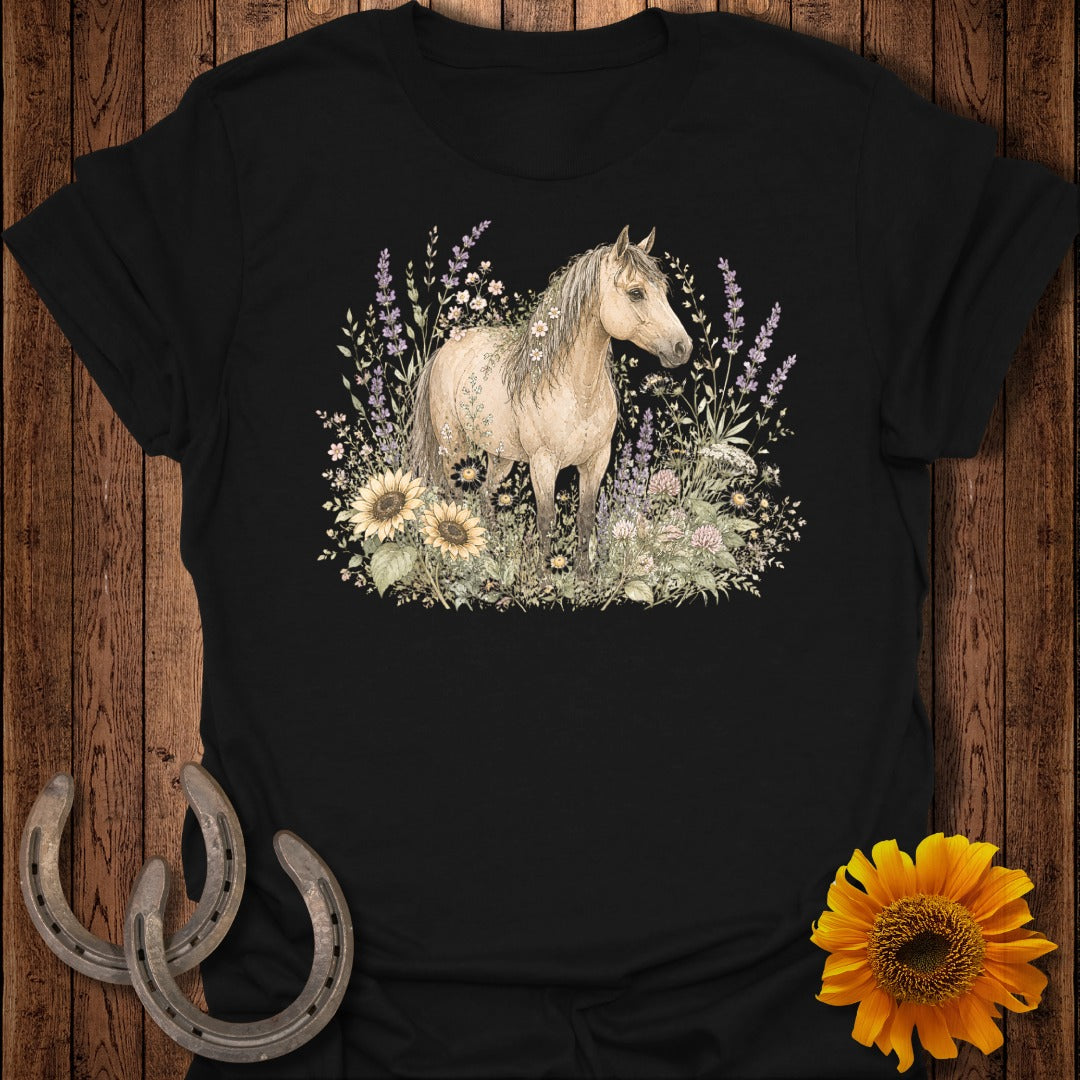 Black t-shirt with a cream horse standing in a field of sunflowers and lavender.