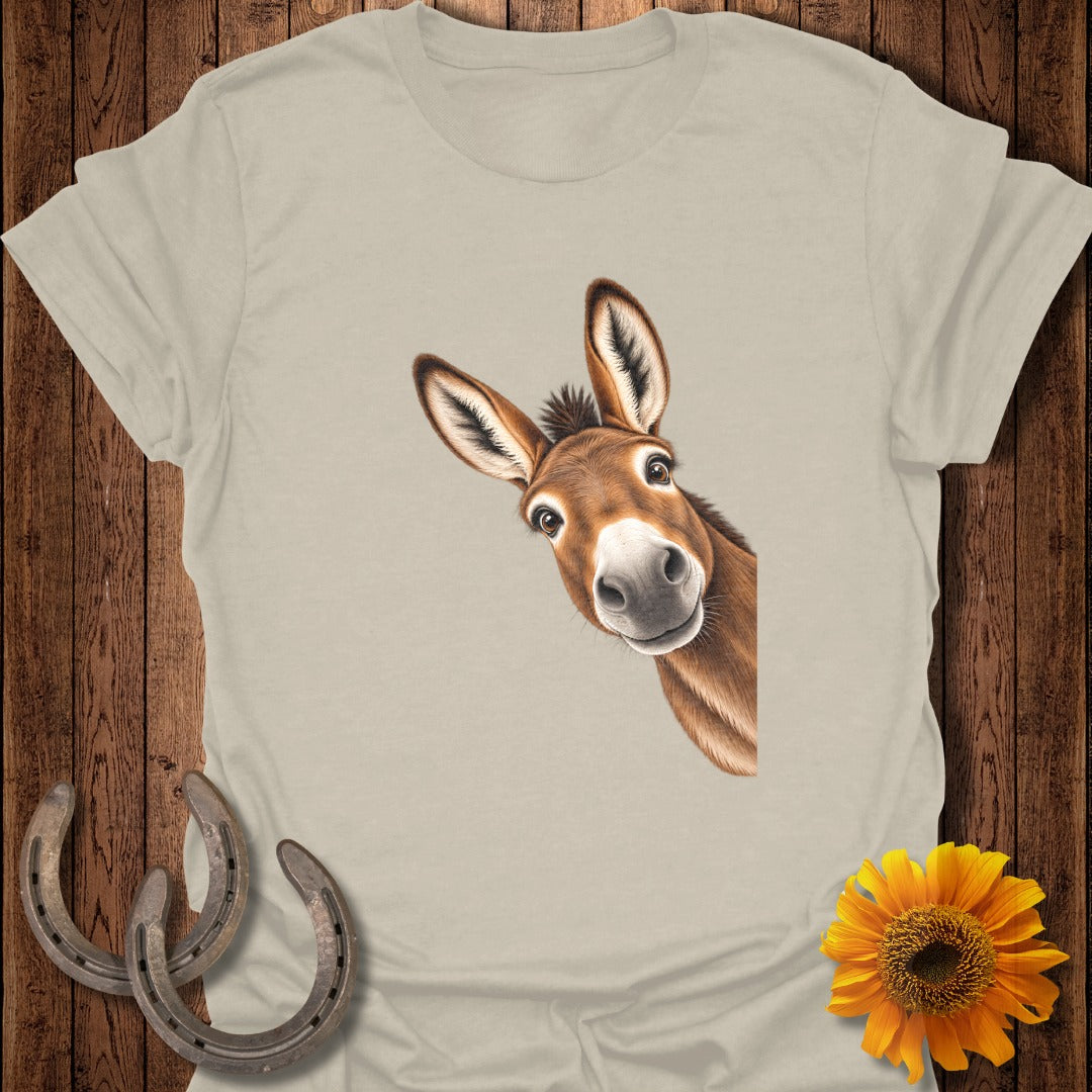 T-shirt with a peeking donkey illustration, horseshoes, and a sunflower.