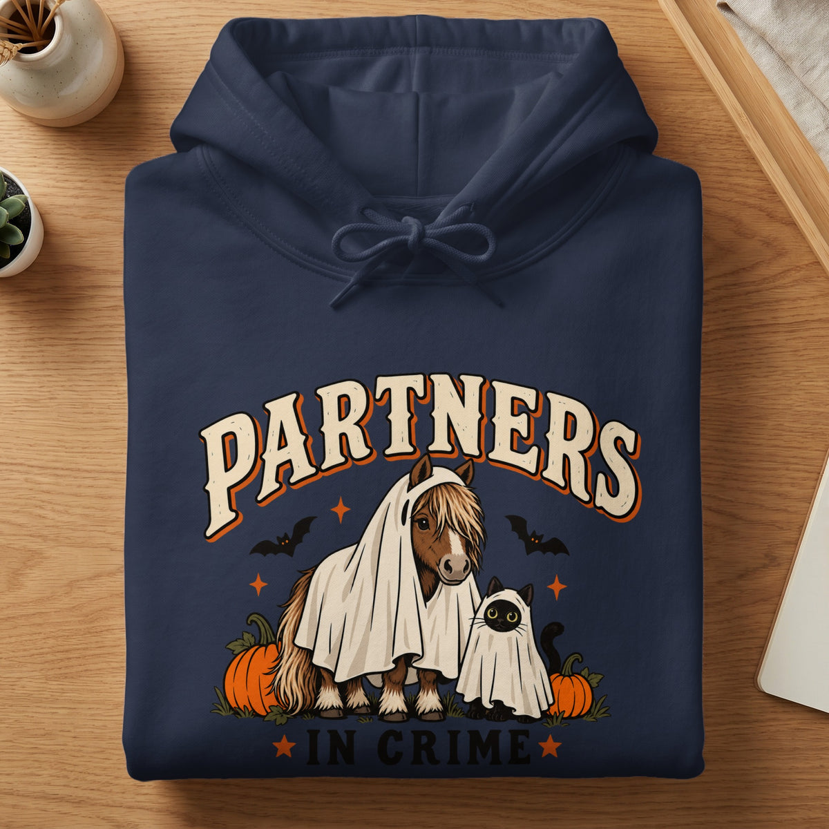 Horse and cat in ghost costumes with "Partners in Crime" text.