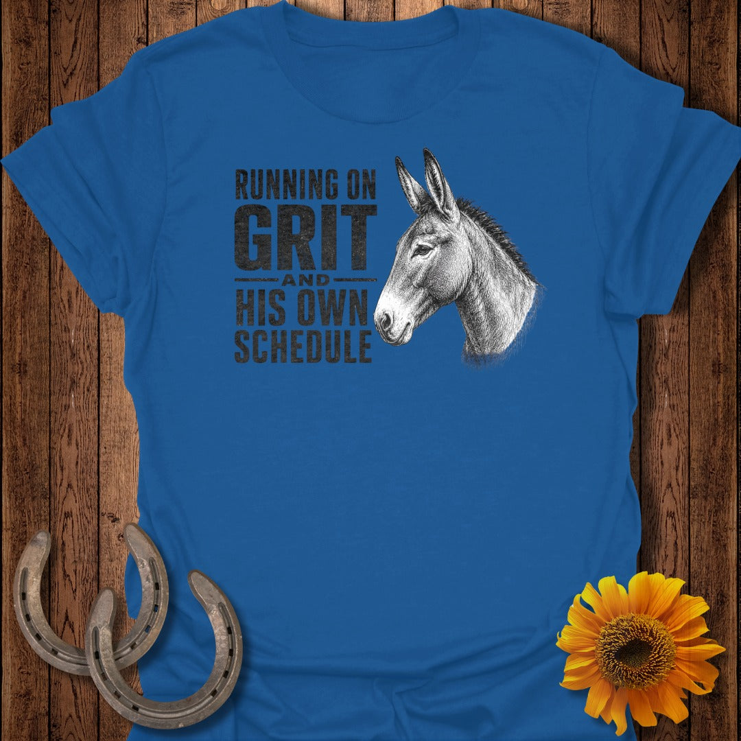 Blue t-shirt with donkey illustration and text "Running on Grit and His Own Schedule".