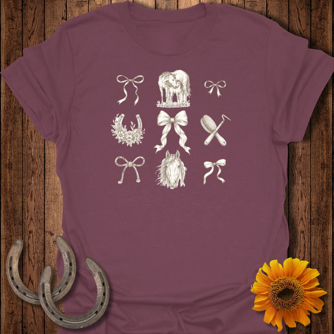 T-shirt with embroidered horse and equestrian motifs including bows, horseshoes, and brush.