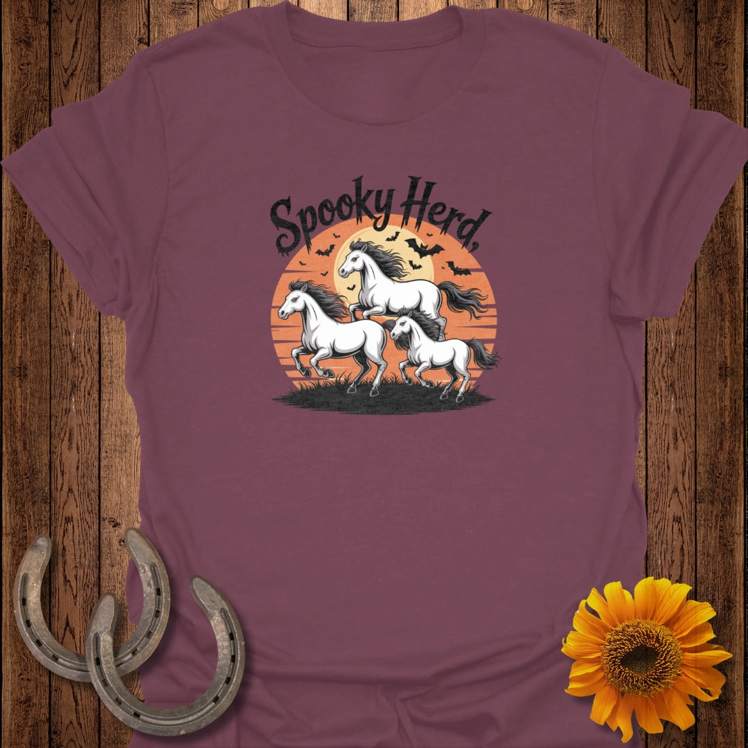Spooky Herd text over three white horses running against a sunset with bats.