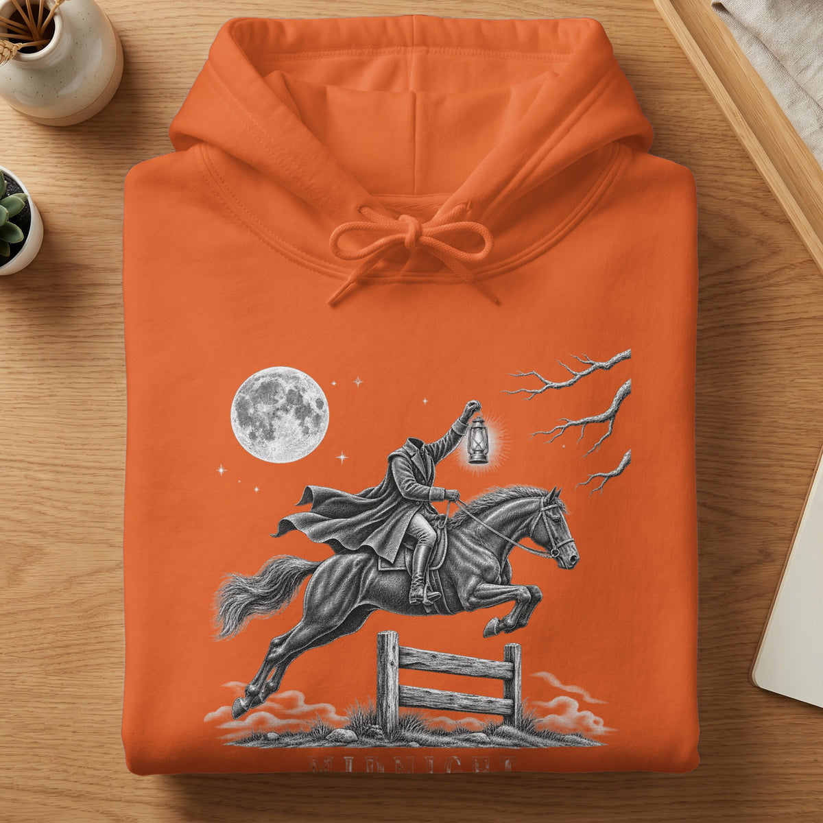 Headless horseman holding lantern jumps over fence under a full moon.