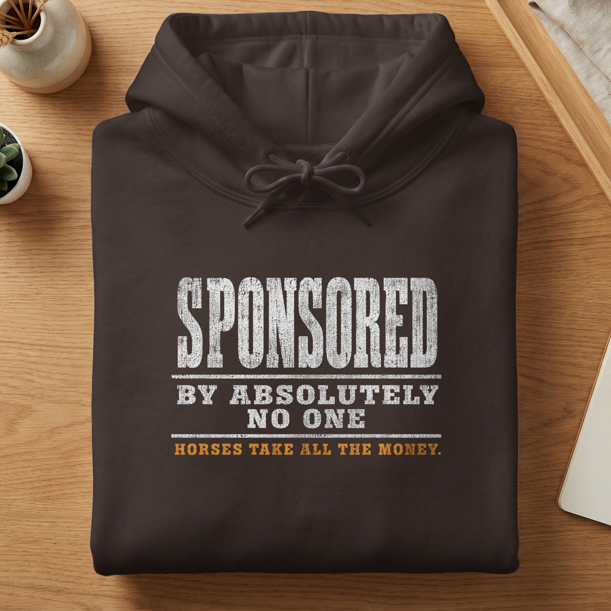 Dark brown hoodie with "SPONSORED BY ABSOLUTELY NO ONE HORSES TAKE ALL THE MONEY" text.