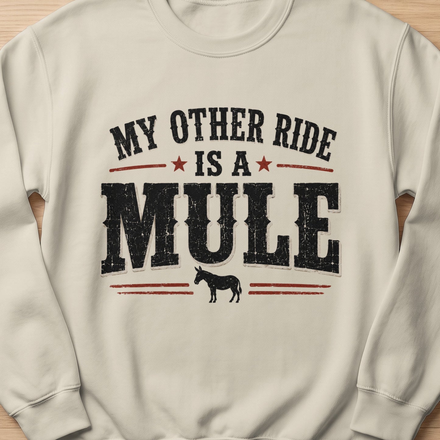Cream sweatshirt with "My Other Ride Is A Mule" text and a silhouette of a mule.
