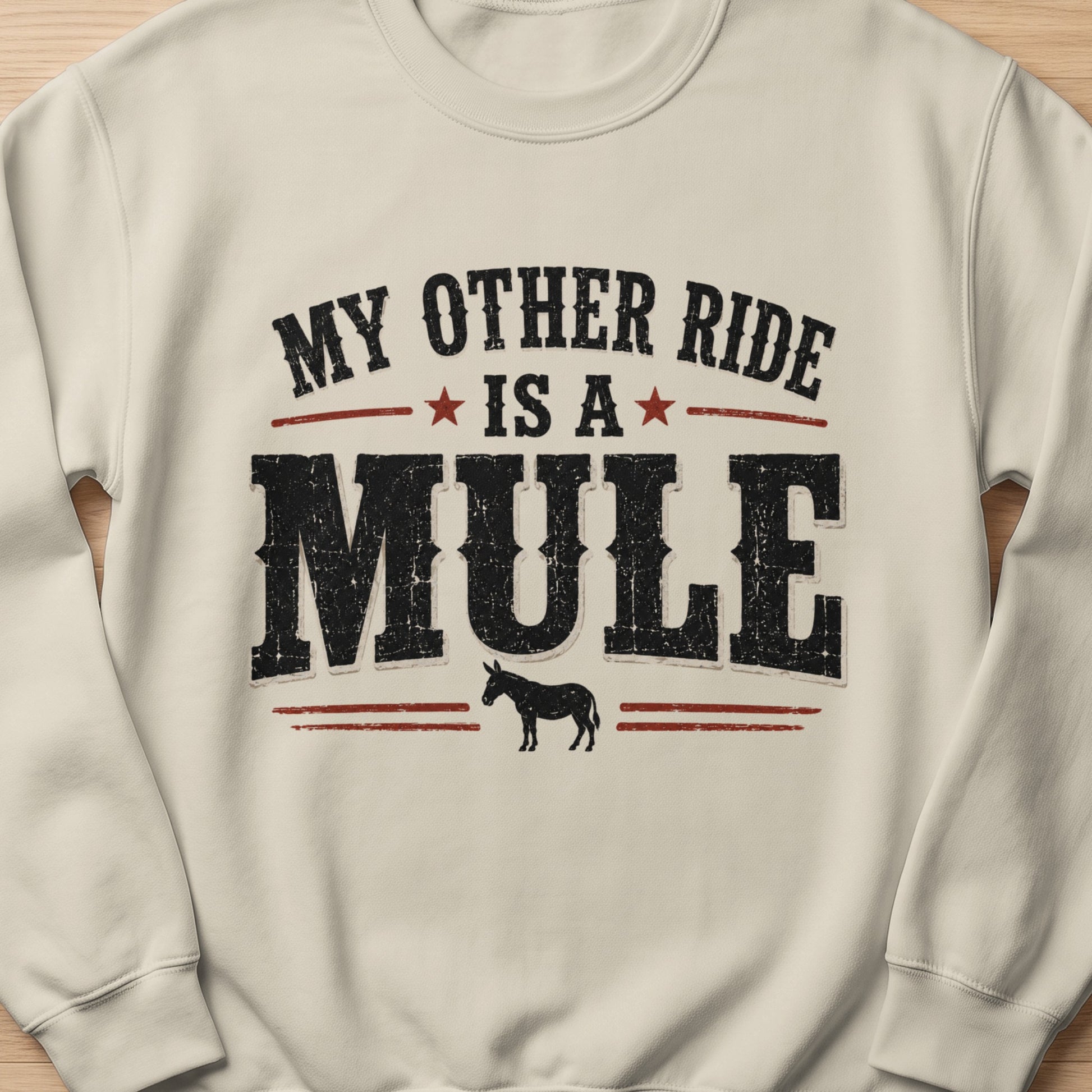 Cream sweatshirt with "My Other Ride Is A Mule" text and a silhouette of a mule.