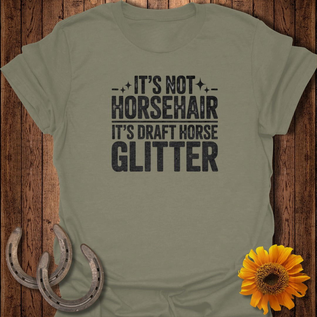 Green t-shirt with "It's not horsehair it's draft horse glitter" text.