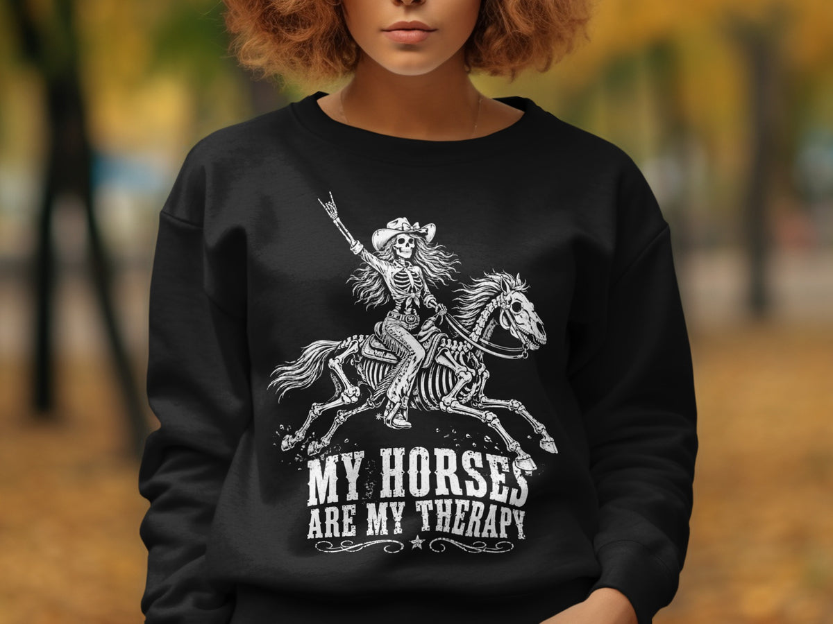 Black sweatshirt with skeleton rider and horse graphic and "MY HORSES ARE MY THERAPY" text.