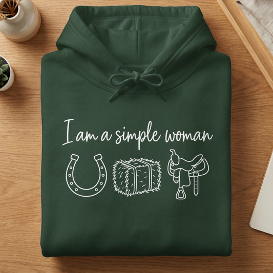 Dark green hoodie with white text "I am a simple woman" and western icons.