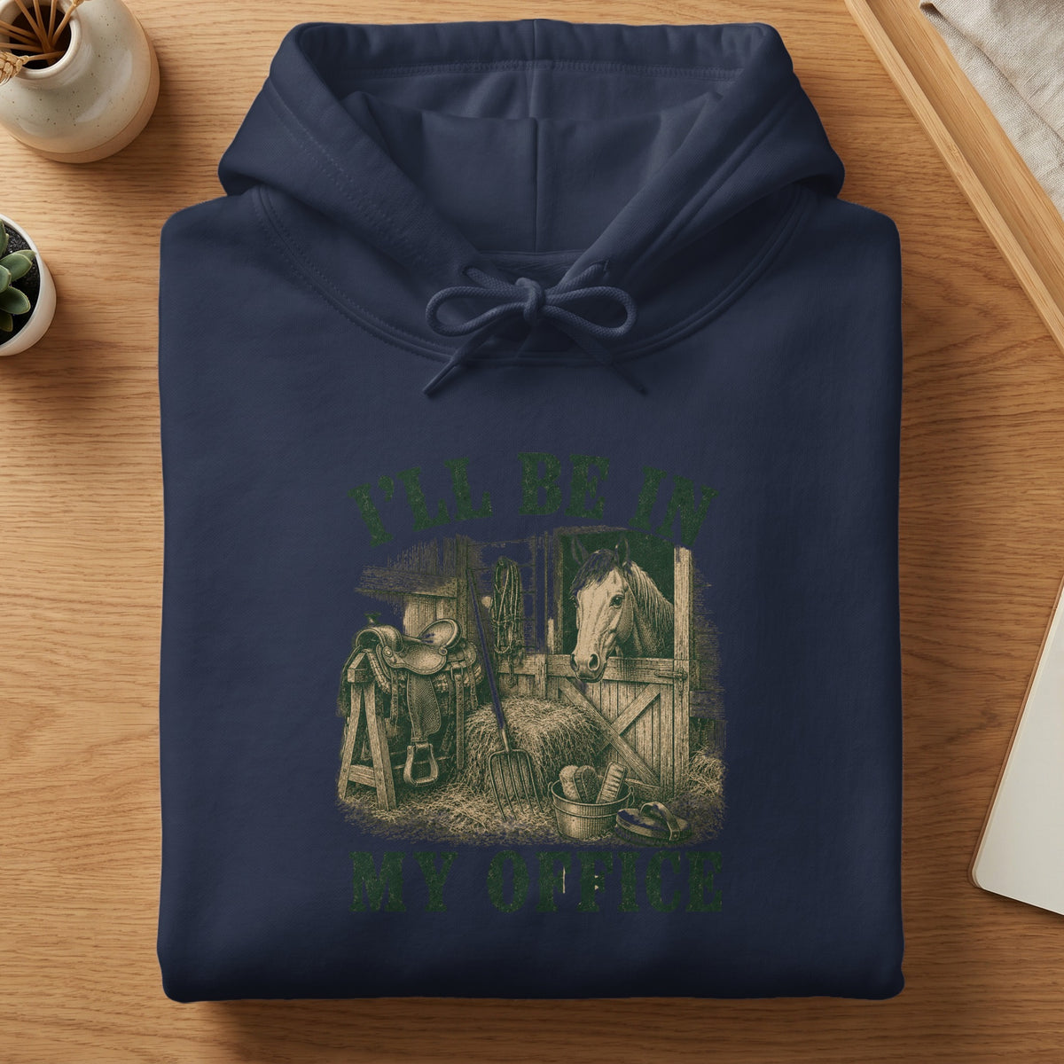 Navy hoodie with a vintage farm scene graphic featuring a horse and saddle, text reads "I'LL BE IN MY OFFICE."