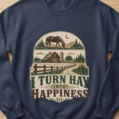Dark blue sweatshirt with a barn, horse, and the text "I TURN HAY INTO HAPPINESS".