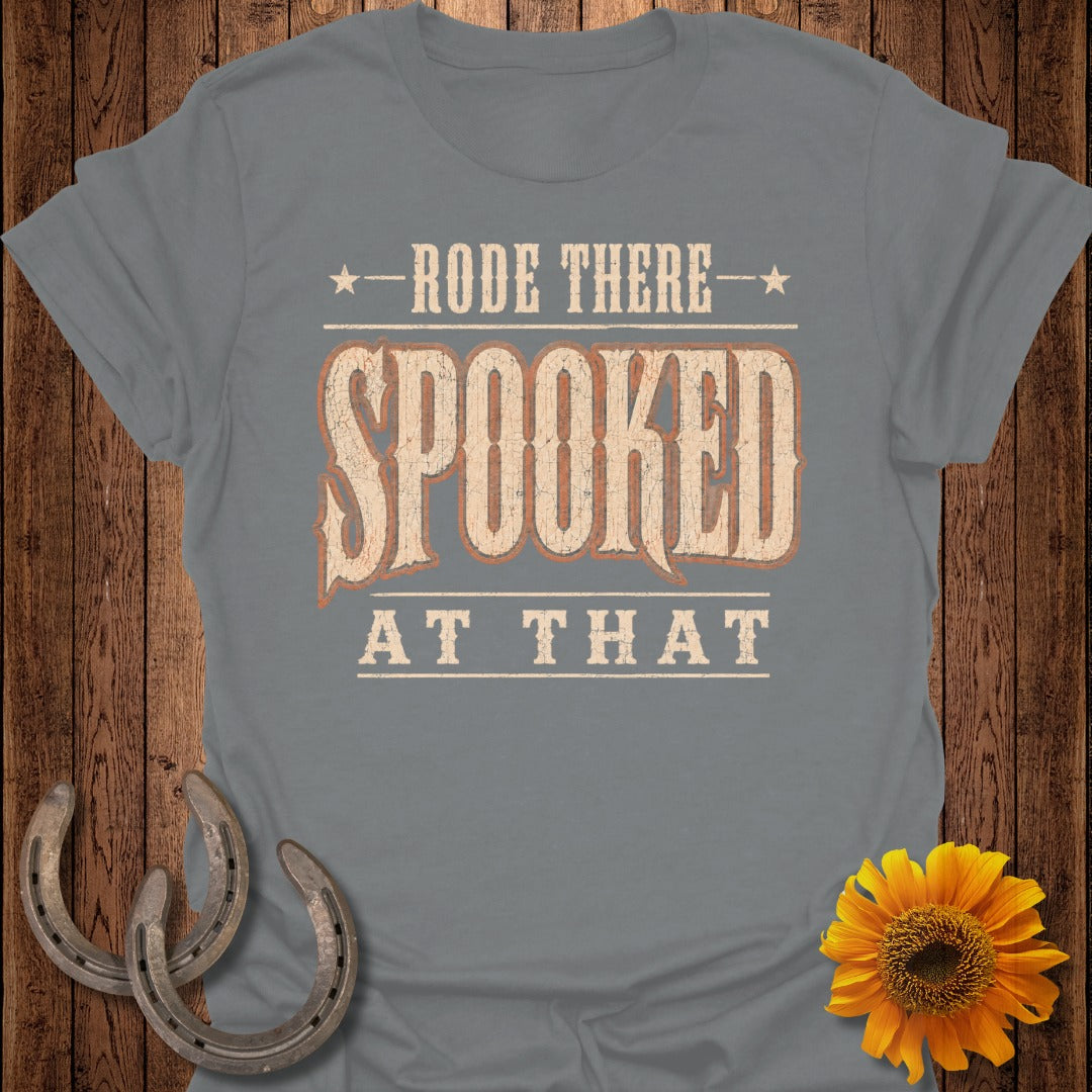 Gray t-shirt with text "Rode there SPOOKED at that" and rustic embellishments.