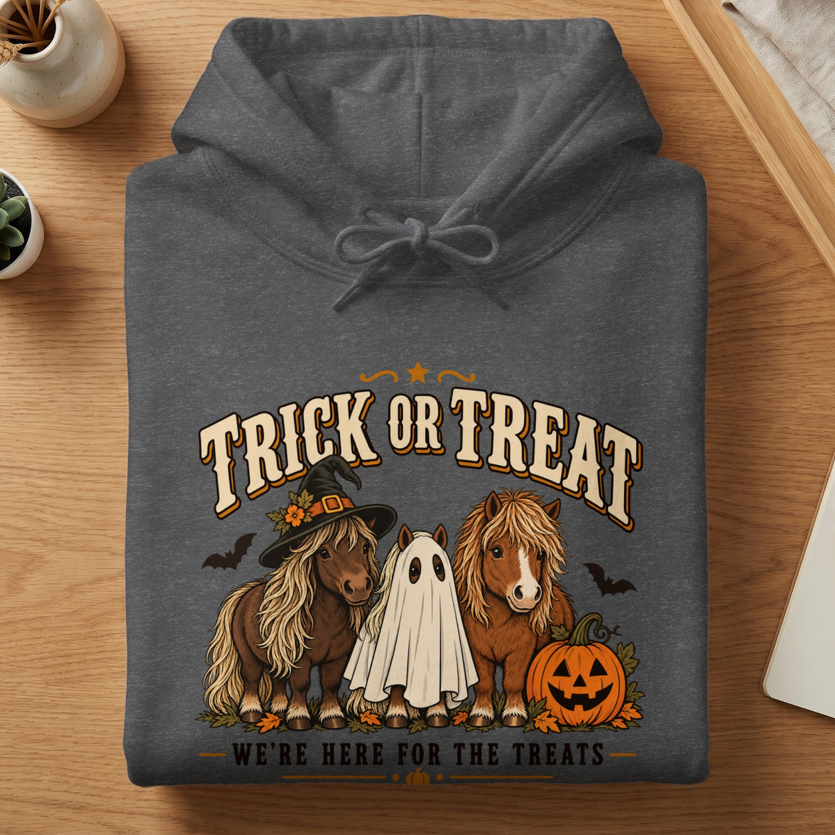 Dark gray hoodie with horses, ghost, pumpkin, and Halloween text.