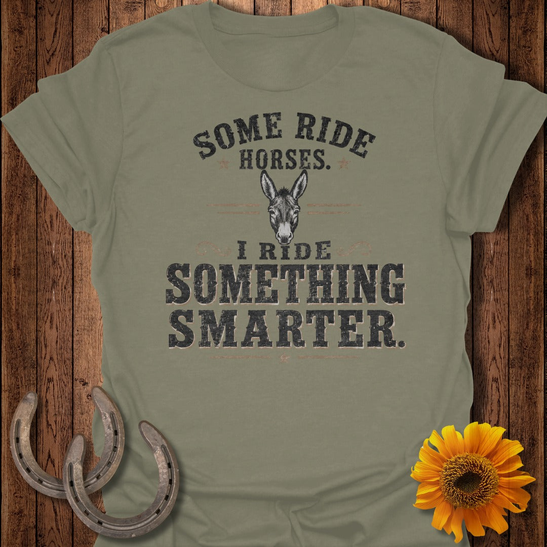 Olive t-shirt with text: "Some Ride Horses. I Ride Something Smarter." and a donkey graphic.