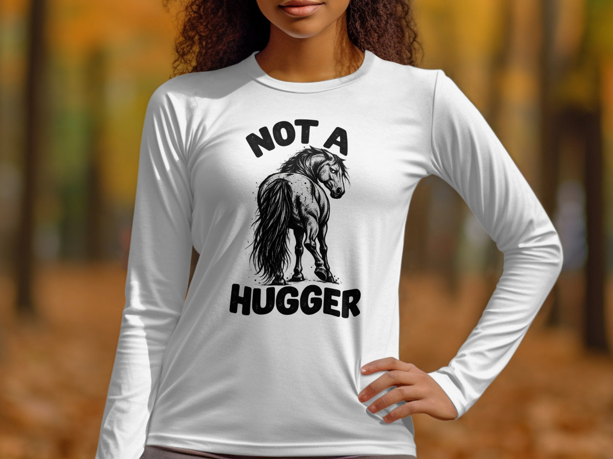 White long-sleeve shirt with a black graphic of a horse and text "NOT A HUGGER".