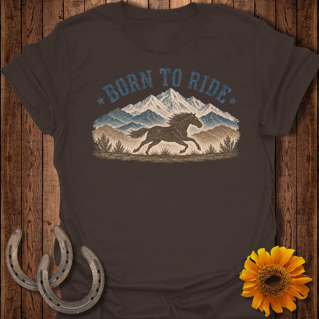 Brown t-shirt with vintage "Born to Ride" text, horse, and mountain graphic.