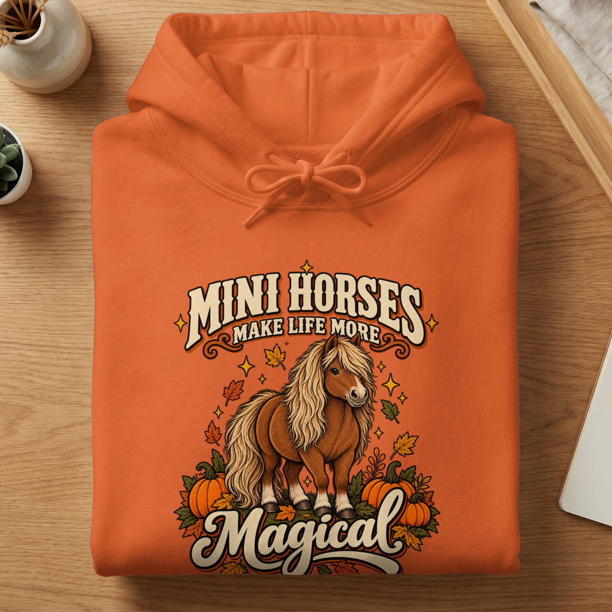 Orange hoodie with "Mini Horses Make Life More Magical" text and pony art.
