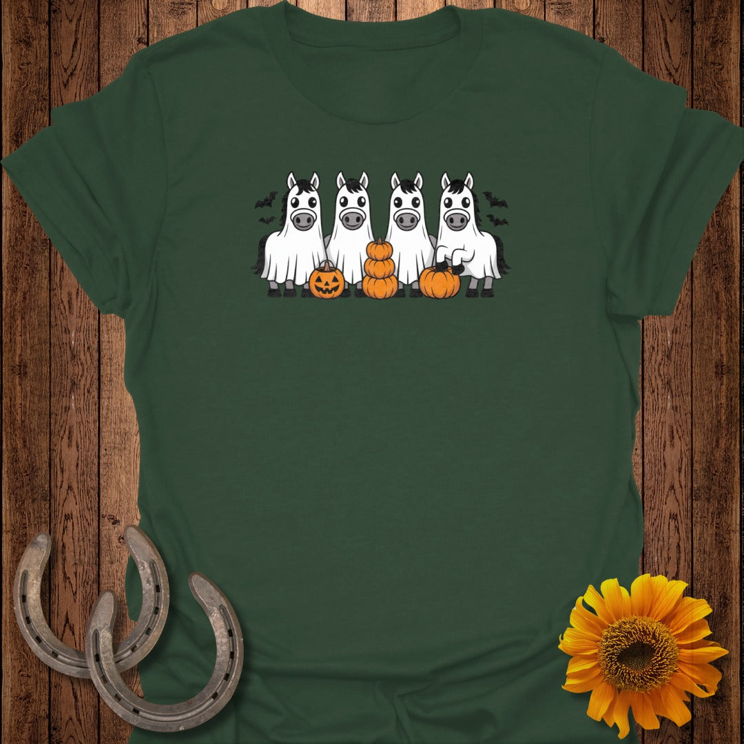 Four horses in ghost costumes stand with pumpkins and bats.
