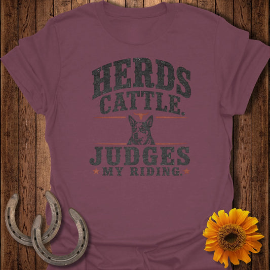 "Herds Cattle Judges My Riding" graphic on maroon t-shirt with dog and horseshoes.