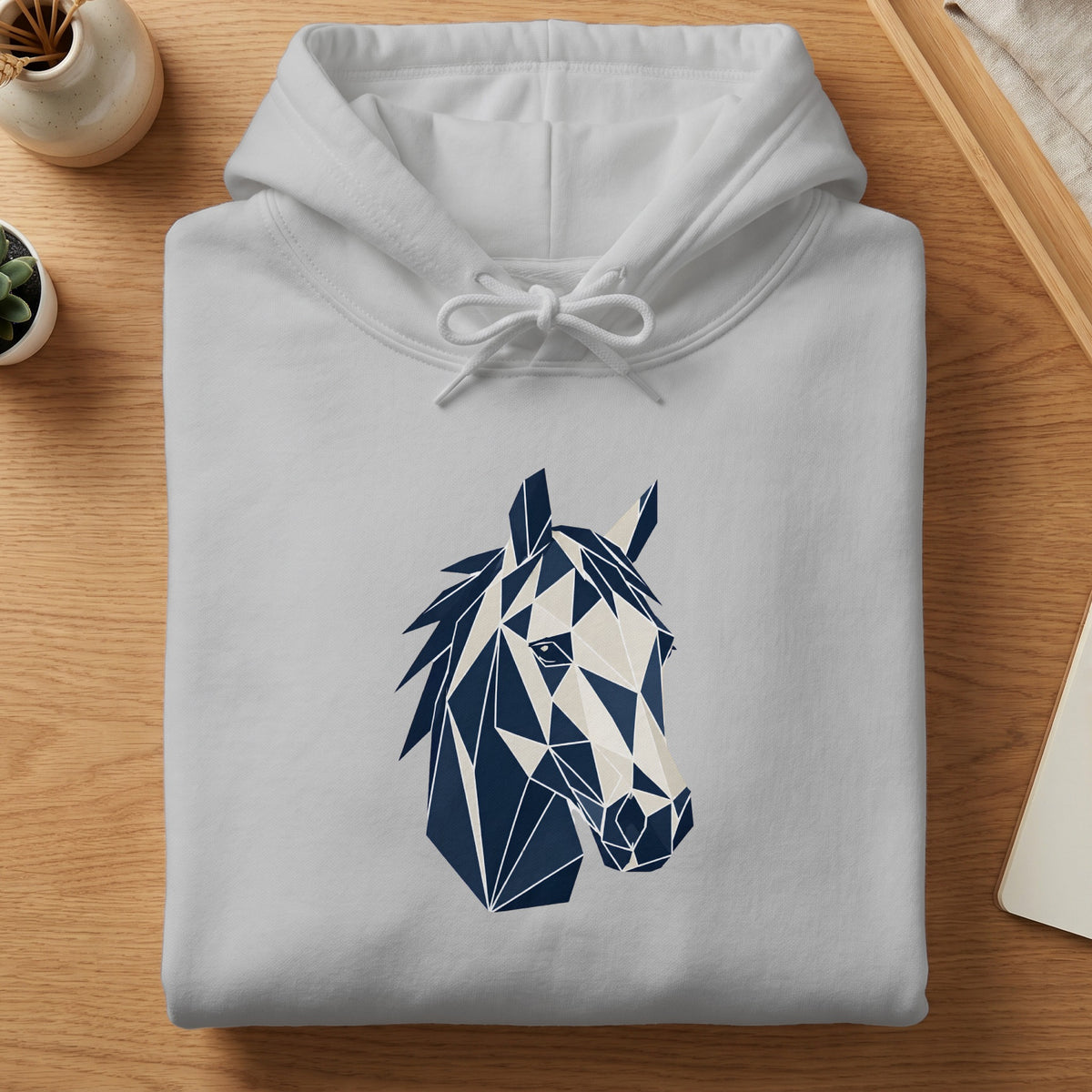 White hoodie with abstract geometric horse head design in navy blue and beige.