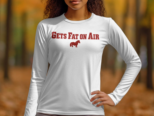 White long-sleeve shirt with red text "GETS FAT ON AIR" and horse graphic.