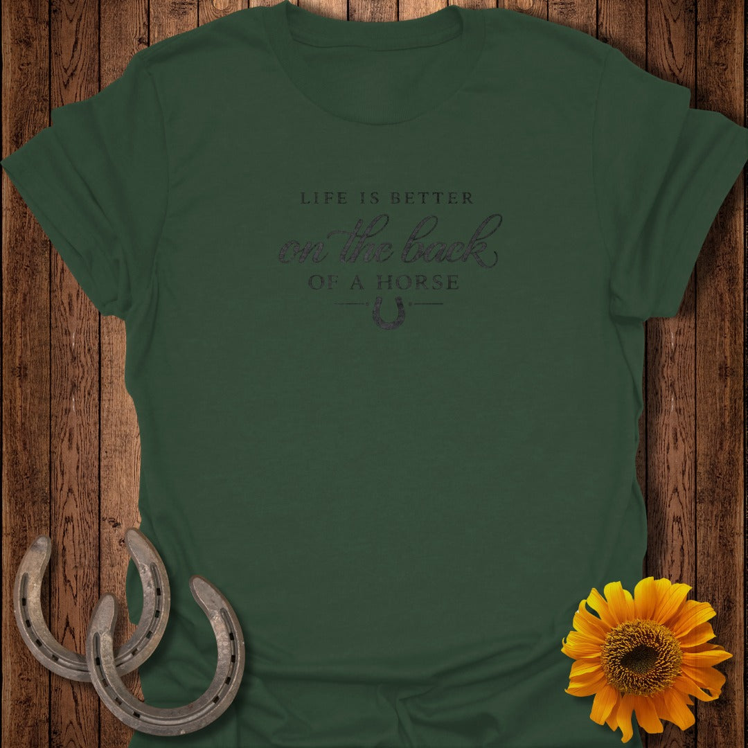 Dark green t-shirt with "Life is better on the back of a horse" graphic.