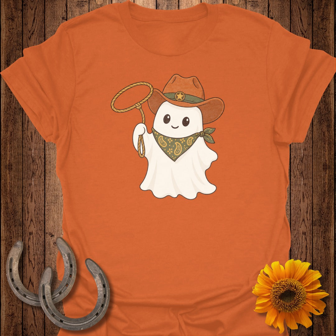 Ghost in cowboy hat and bandana holding a lasso, on orange t-shirt.