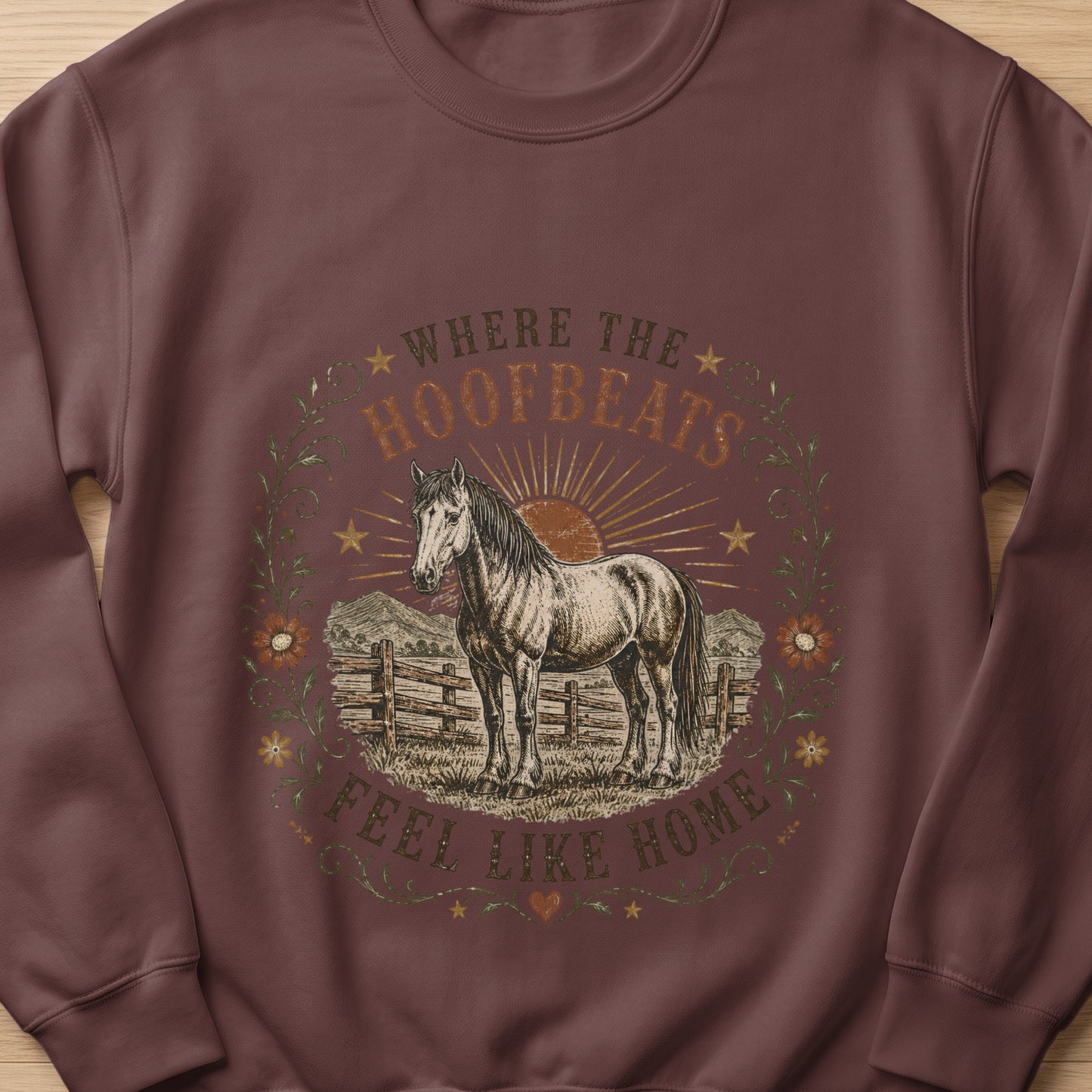 Horse graphic with text "Where the Hoofbeats Feel Like Home" on a maroon sweatshirt.