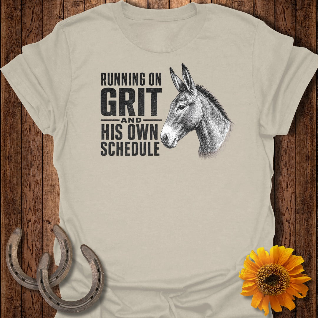 Cream t-shirt with donkey illustration and text "Running on Grit and His Own Schedule."