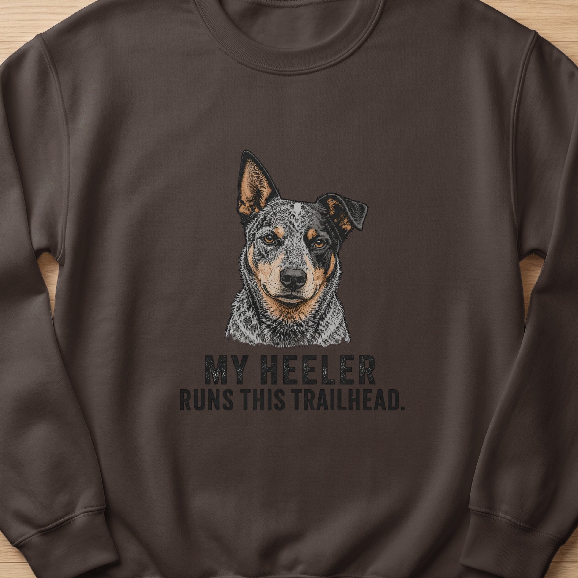 Brown sweatshirt with a drawing of an Australian Cattle Dog and text.