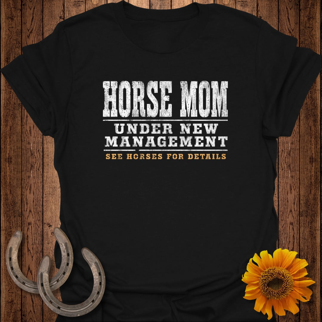 Black t-shirt with "HORSE MOM UNDER NEW MANAGEMENT SEE HORSES FOR DETAILS" text.