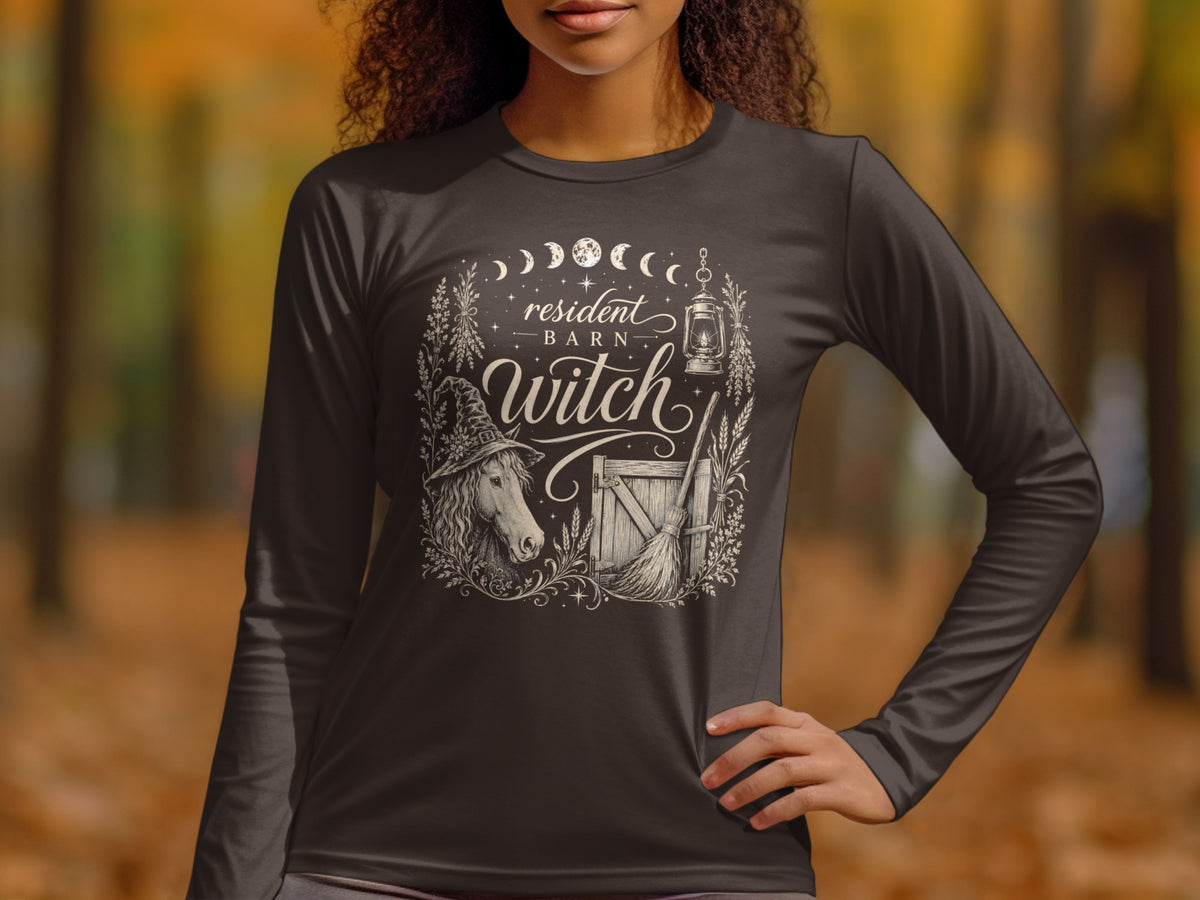 Dark long-sleeve shirt with a "resident BARN witch" graphic featuring a horse and broom.