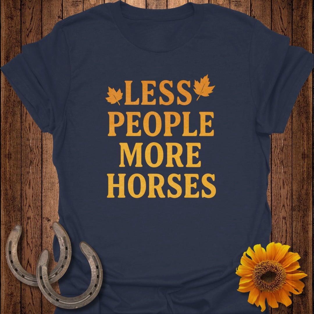 Navy t-shirt with orange text "LESS PEOPLE MORE HORSES" and leaf graphics.