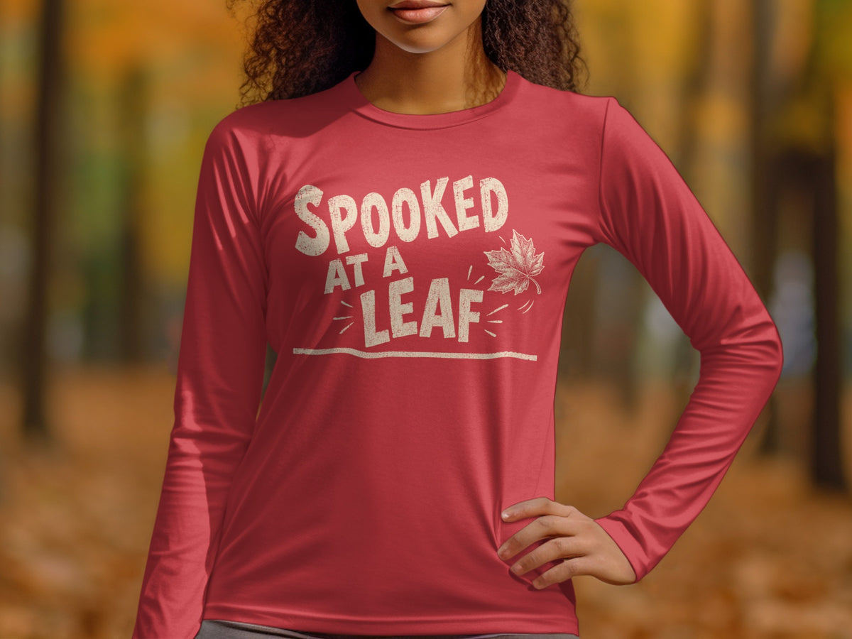 Red long sleeve t-shirt with "SPOOKED AT A LEAF" text and leaf graphic.