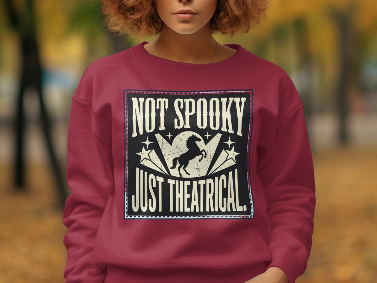 Crewneck sweatshirt with "NOT SPOOKY JUST THEATRICAL" text and a silhouette of a horse.