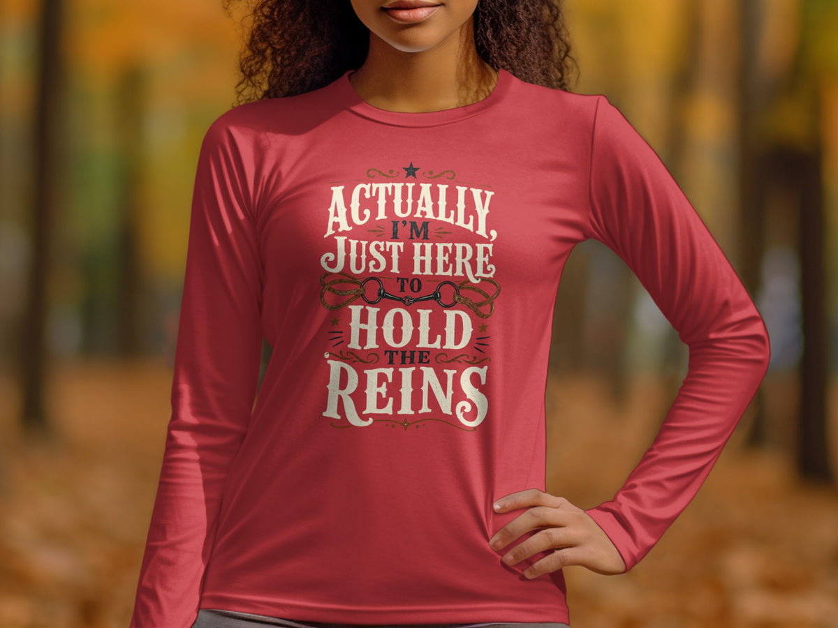 Red long-sleeve shirt with text "Actually I'm Just Here to Hold the Reins."