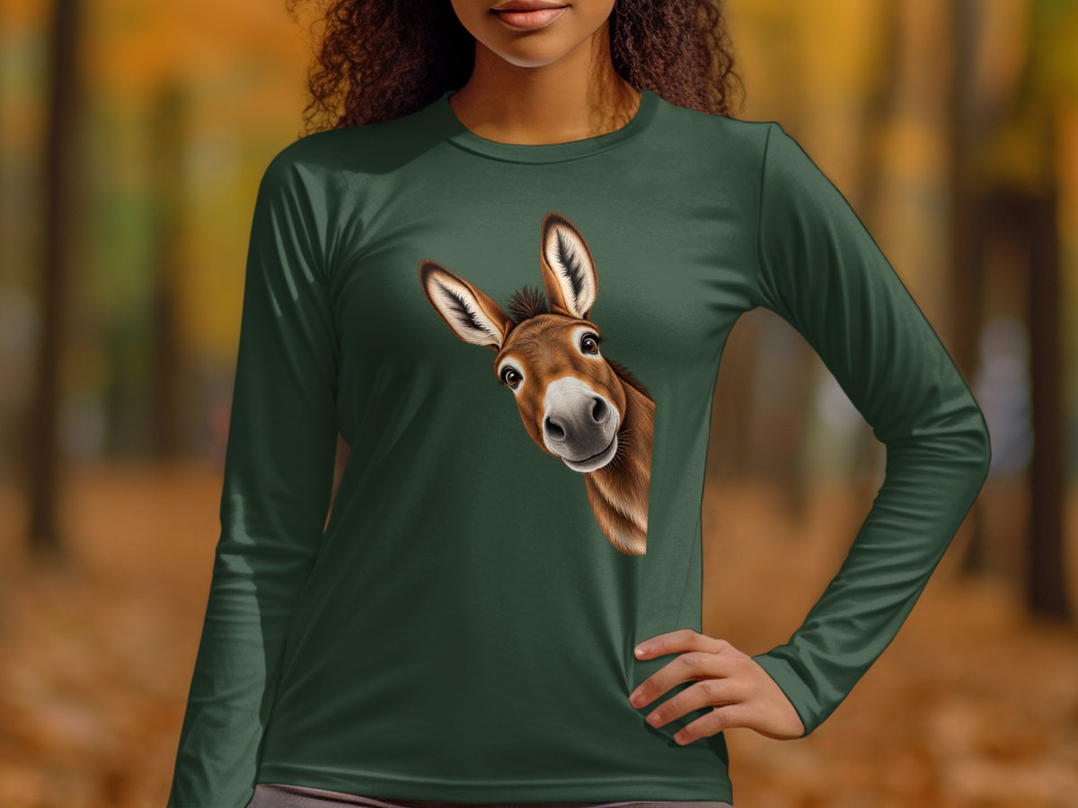 Woman wearing a green long-sleeve t-shirt with a peeking donkey graphic.