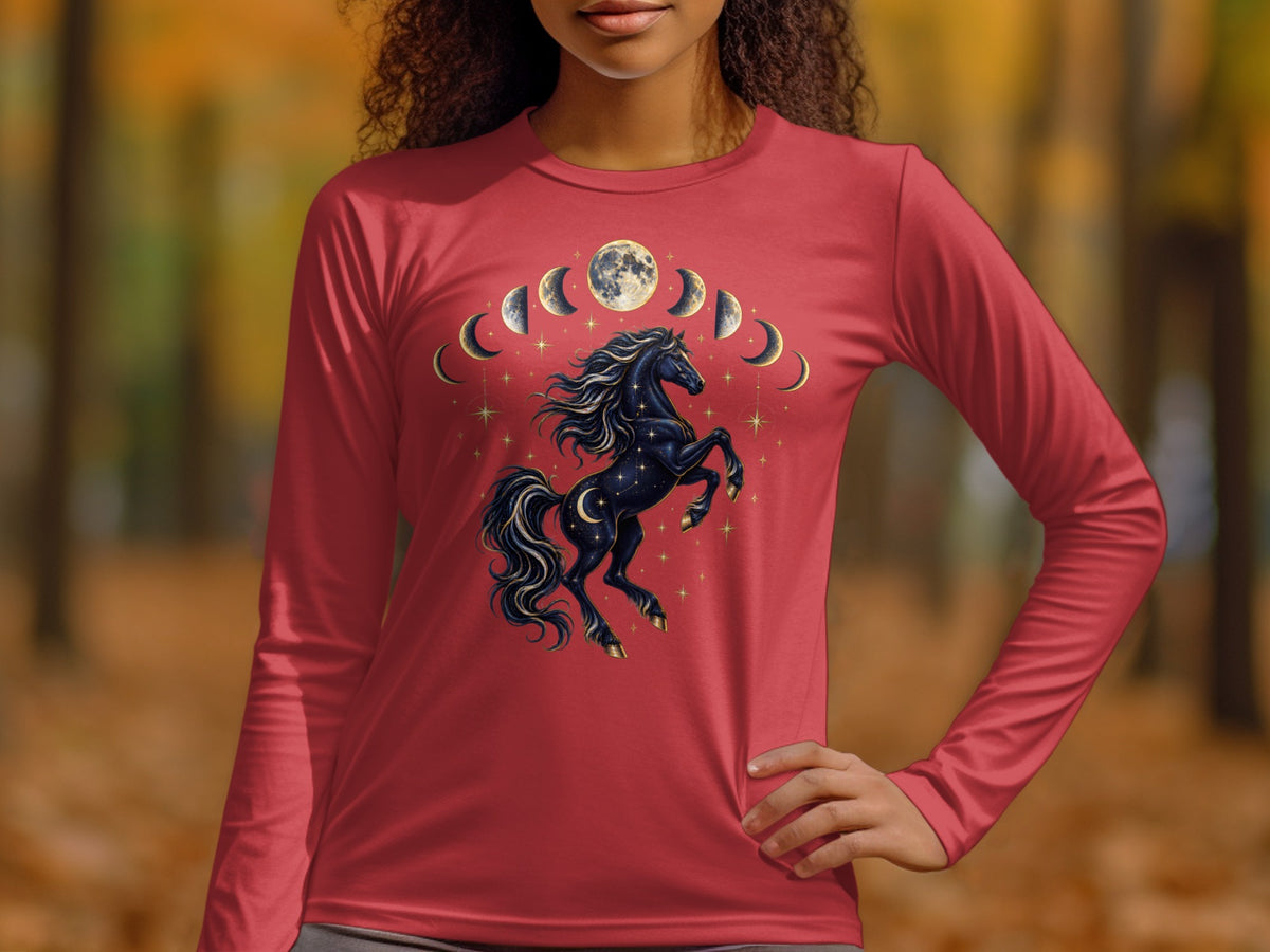 A person wearing a red long-sleeved shirt featuring a graphic of a rearing black horse beneath moon phases.