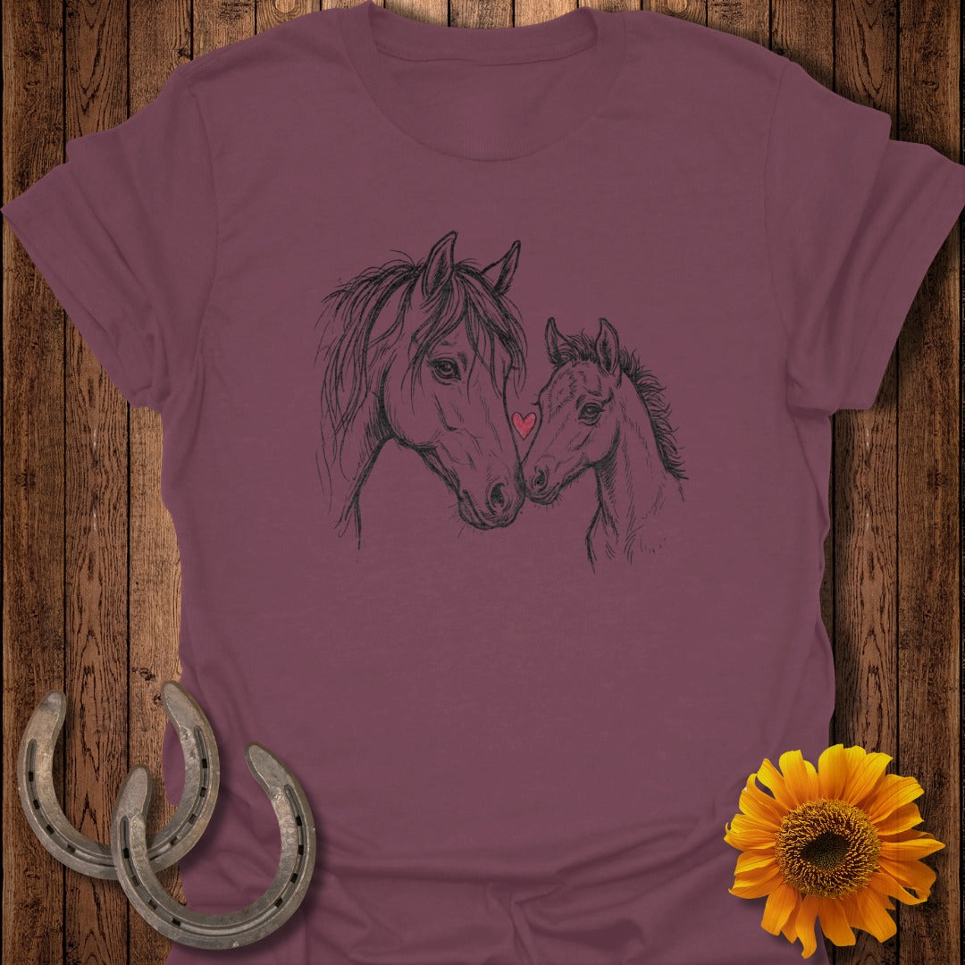 Line drawing of two horses, a mare and foal, with a sunflower and horseshoes.