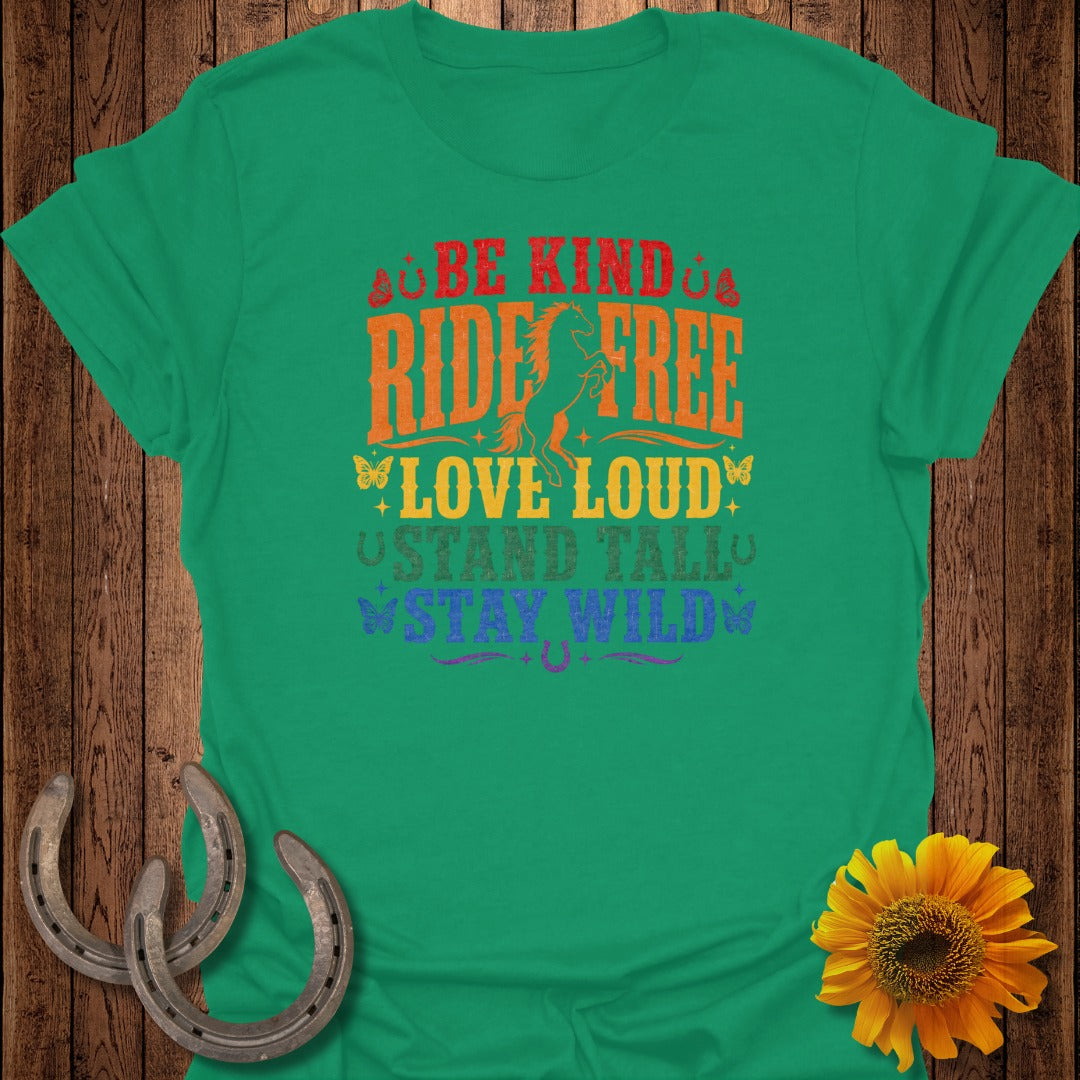 Green t-shirt with "Be Kind, Ride Free, Love Loud, Stand Tall, Stay Wild" text and horses.