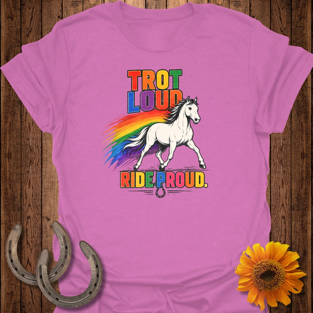 Pink t-shirt with "TROT LOUD RIDE PROUD" text and a white horse with rainbow mane.