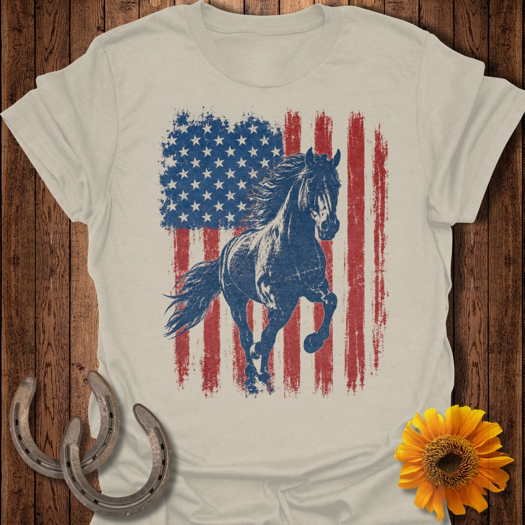 Distressed American flag with a galloping horse on a light beige t-shirt.