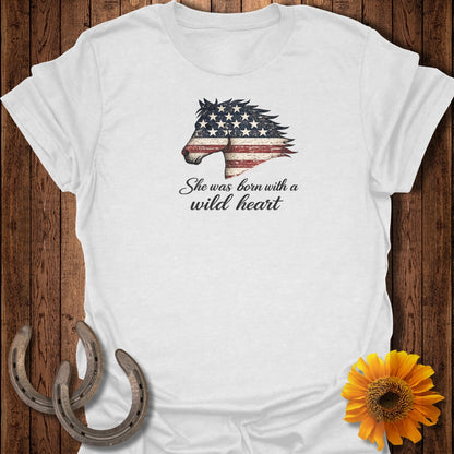 White t-shirt with distressed American flag horse head and "She was born with a wild heart" text.