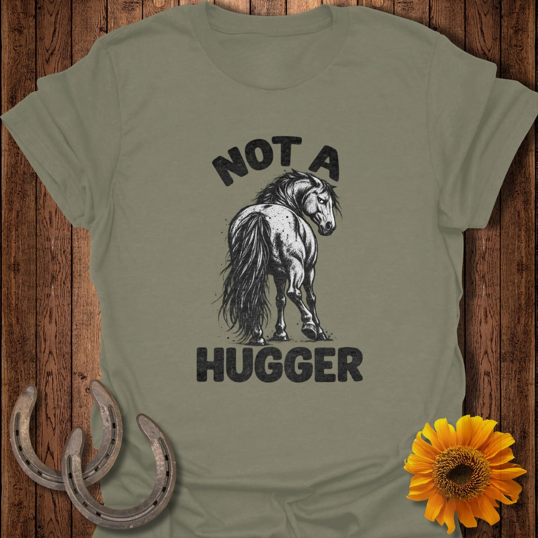 Olive green t-shirt with a black illustration of a horse looking back and text reading NOT A HUGGER.